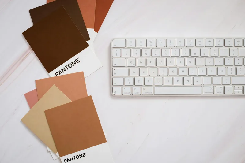 The Canva color picker panel showing hex codes being entered for brand primary and secondary colors, with font selections displayed in the side panel