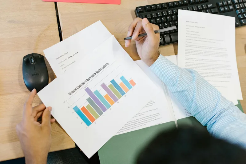 A simple spreadsheet tracking lead magnet conversion rate changes across six 30-day improvement cycles, showing a gradual upward trend from 8% to 27%