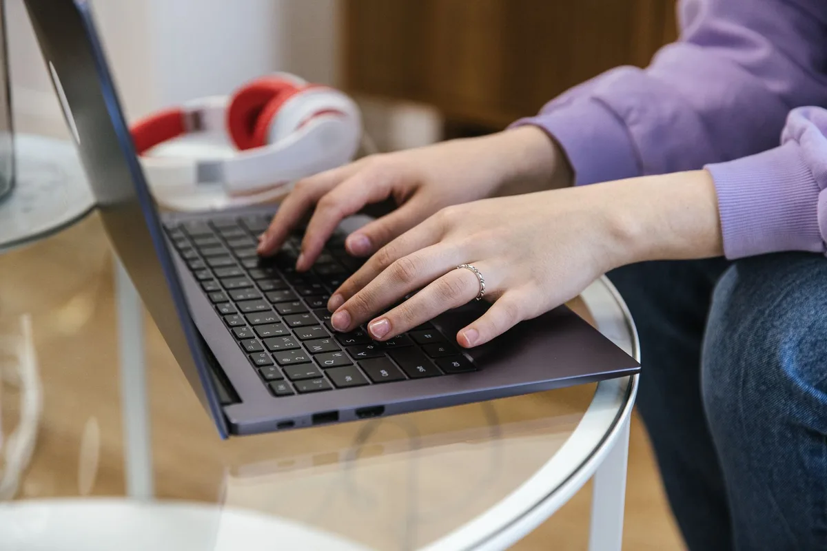 A creator at a laptop writing an email follow-up sequence for their lead magnet subscribers