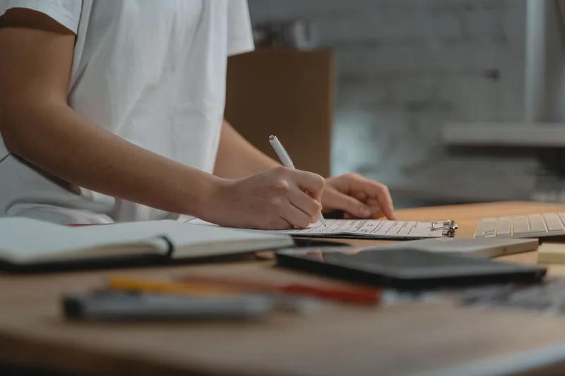Written checklist document on a workspace desk, representing a specific, immediately usable lead magnet format